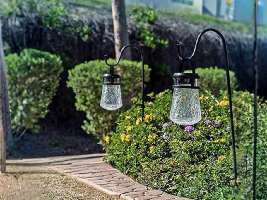 Home Zone Security ELJ8205V 2-Pack Crackle Glass Solar Lanterns along sidewalk