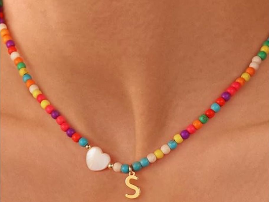 Initial necklace on a colorful beaded choker
