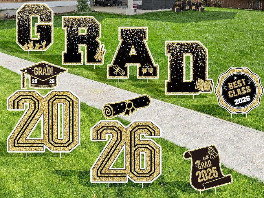 graduation signs stuck into grass
