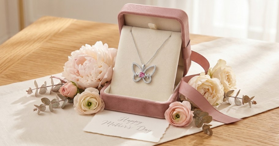 Kay Jewelers Mom necklace in a pink box surrounded by flowers