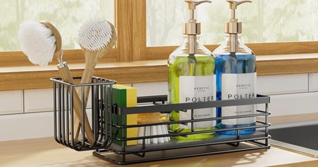 black sink caddy with sponge, soap, and brushes