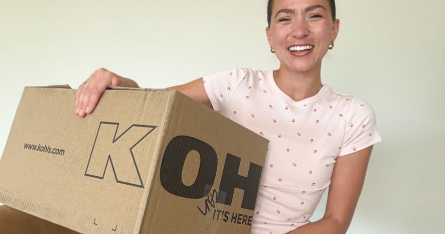 Woman holding a Kohl's shipping box