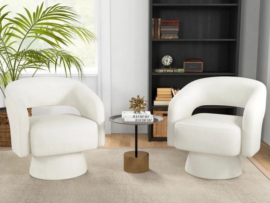 two white Latitude Run Swivel Upholstered Barrel Chairs in living room