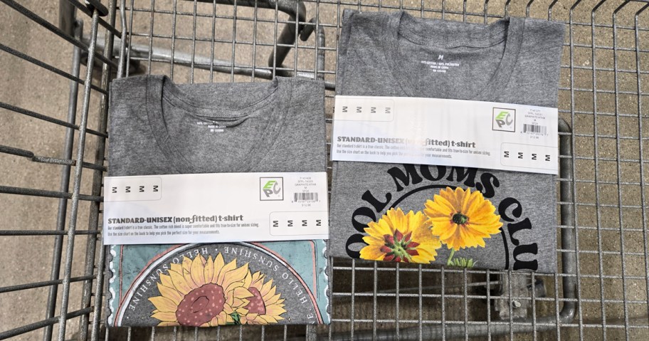 two grey graphic tees in a shopping cart