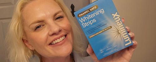stefanie holding Lumineux Teeth Whitening Strips 21 Treatments box