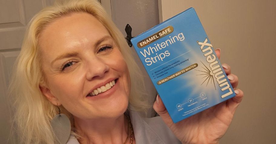 stefanie holding Lumineux Teeth Whitening Strips 21 Treatments box