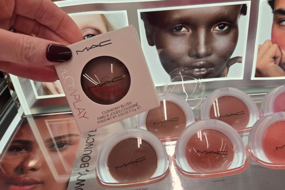 hand grabbing blush in box