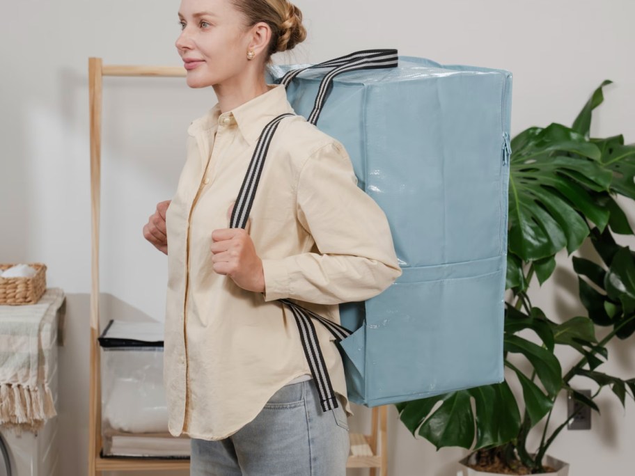 Women wearing blue storage bag as a backpack