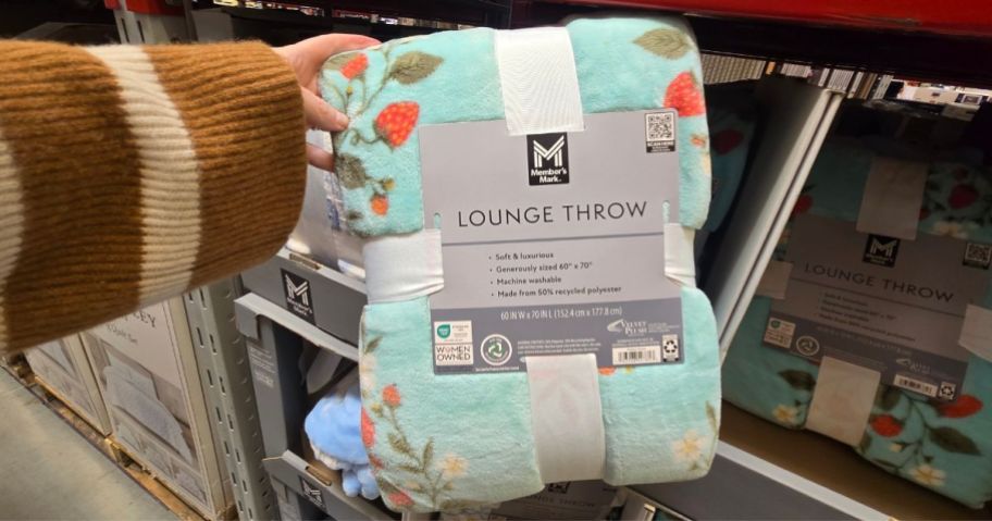 Strawberry Damask throw blanket in hand in store