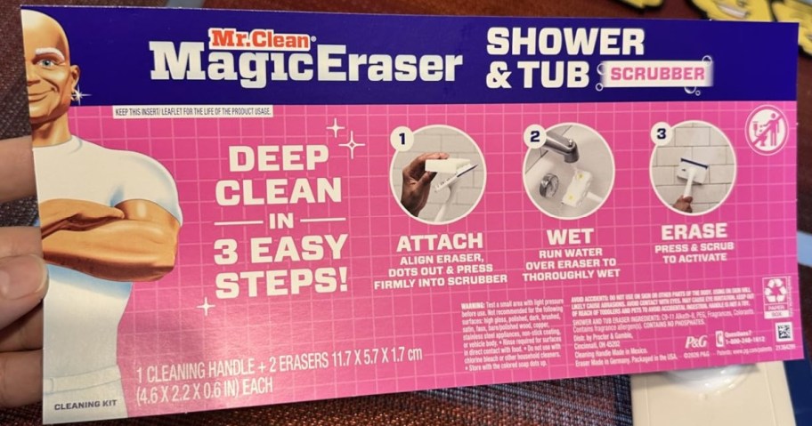 Packaging for Mr. Clean Magic Eraser Shower & Tub Scrubber showing three steps: Attach, Wet, Erase.