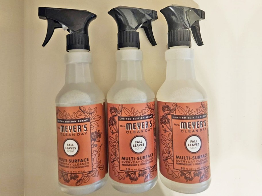 three bottles of Mrs. Meyer's Multi-Surface Sprays in fall leaves scent