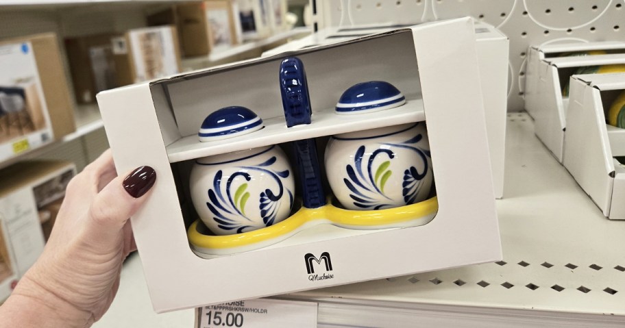 hand holding a boxes ceramic salt & pepper shaker set