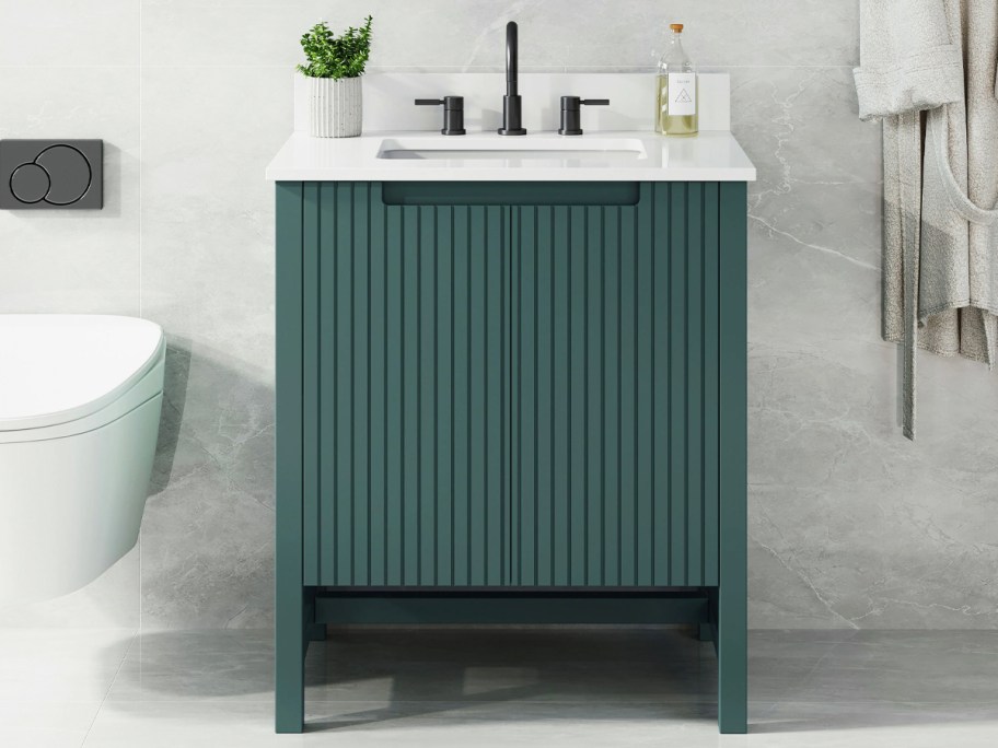 green vanity in a bathroom