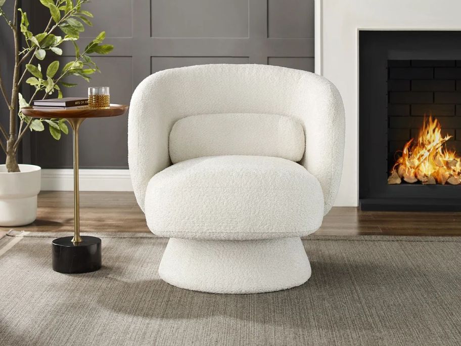 white Orren Ellis Saboor Swivel Accent Chair in living room
