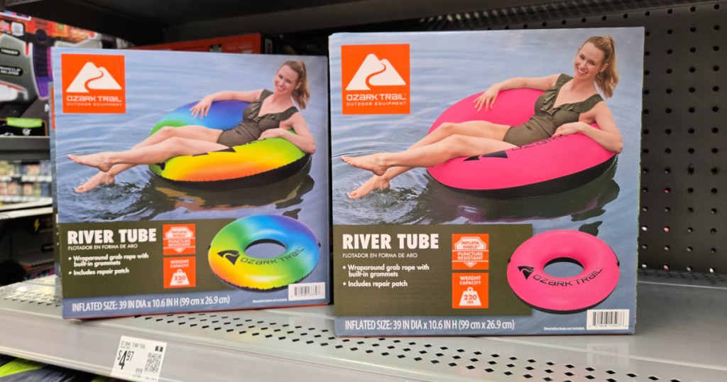 Pink and rainbow colored Ozark Trail River tubes on Walmart store shelf