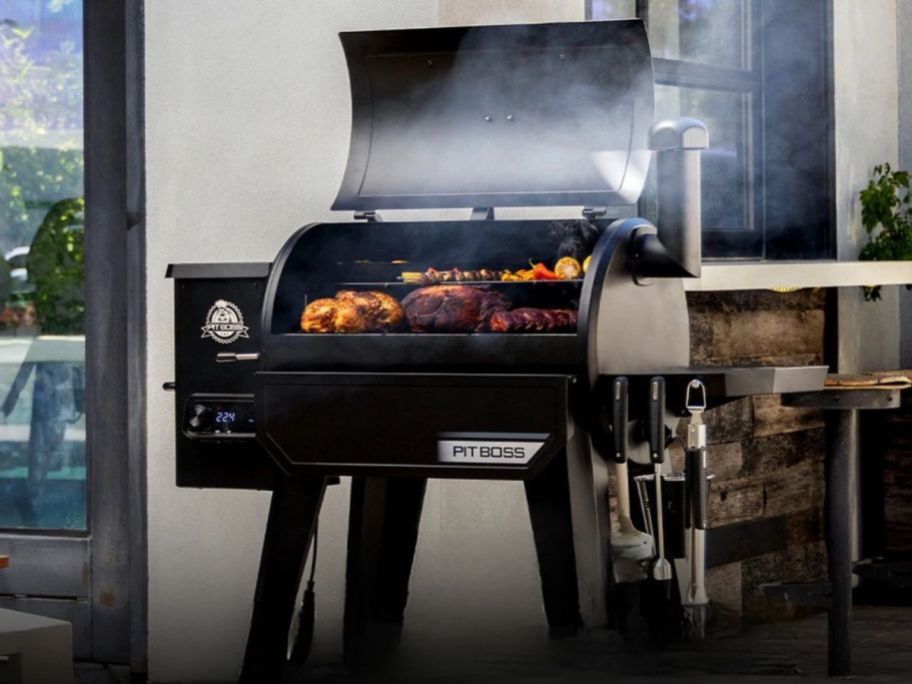 Pit Boss 850 DX Series Black Pellet Grill w/ Smart Compatibility on patio
