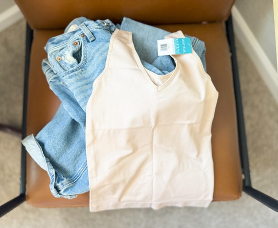 Beige shapewear tank top worn with jeans