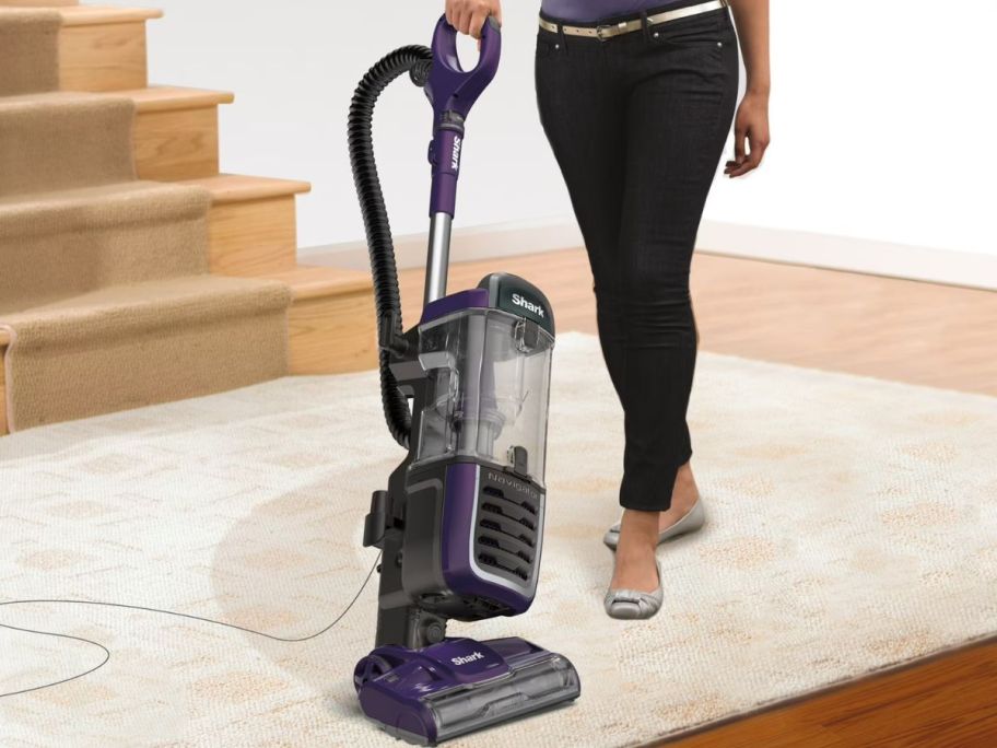 Woman holding Shark eggplant vacuum