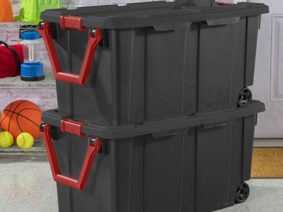 two walmart storage containers in black and red