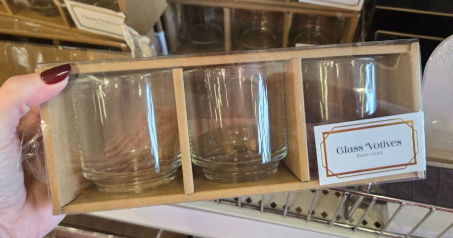 Hand holding a Clear Glass Votives 3-pack from target's Bullseye's Playground