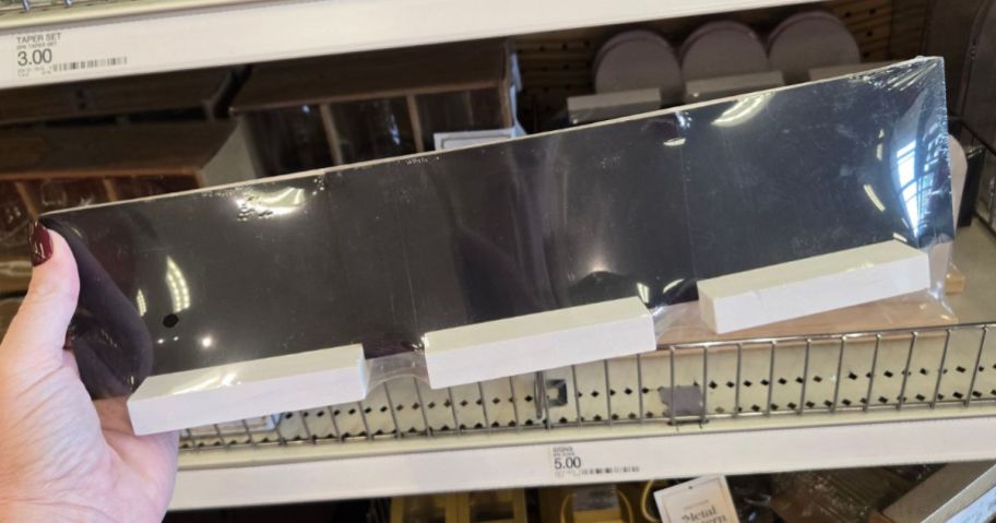 Hand holding a Chalkboard Signs 3-pack from Target's Bullseye's Playground