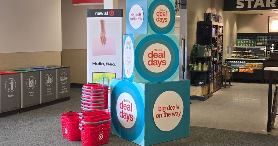 Signs advertising Target Deal Days next to Target shopping Baskets