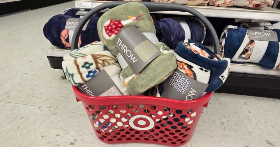 A Target shopping basket filled with throw blankets