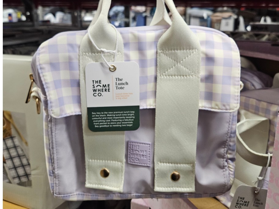 A lavender and white checkered lunch tote.