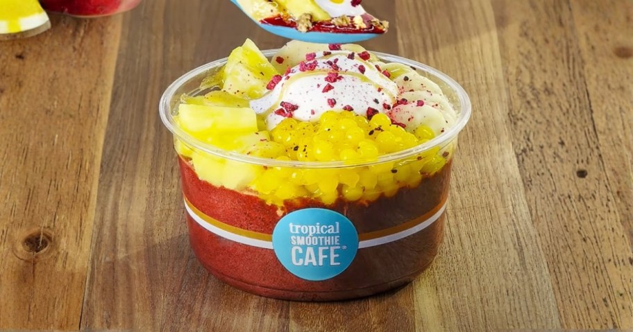 tropical smoothie acai bowl with boba and fresh fruit on top