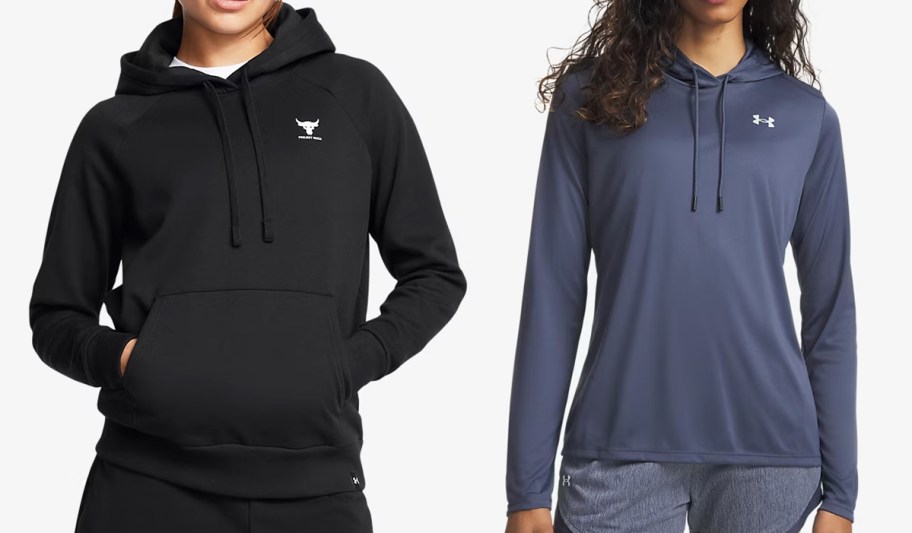 two women in black and blue hoodies