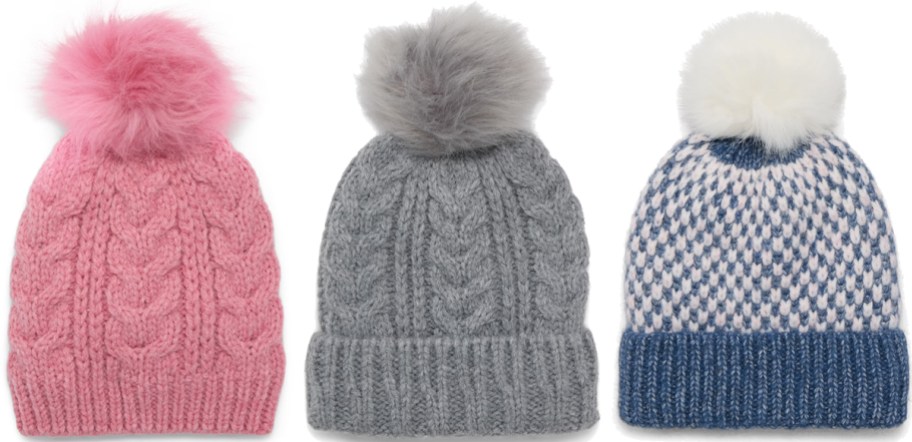 three pom beanies in a row