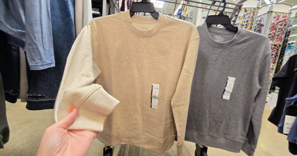 Time and tru sweatshirts hanging on Walmart shopping cart