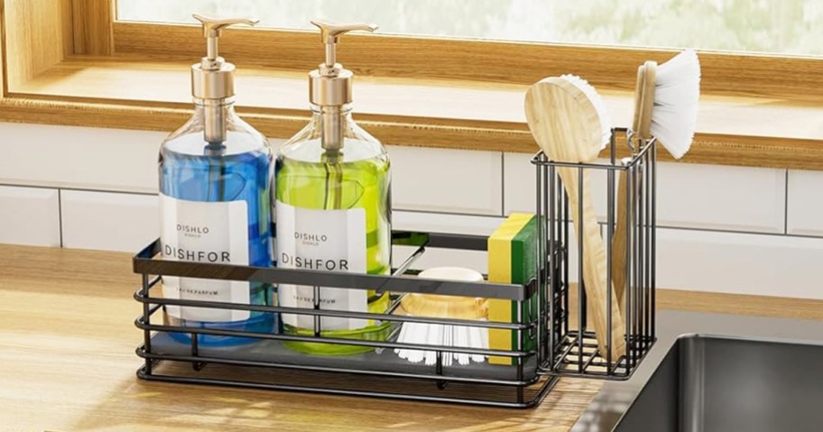 black sink caddy with sponge, soap, and brushes