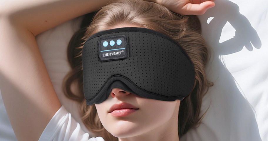 woman wearing a black sleep mask