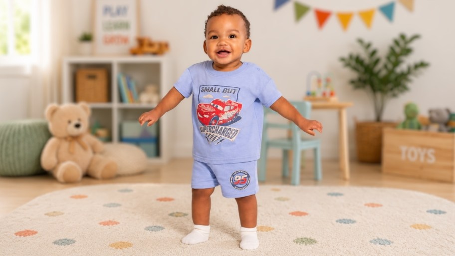 a little toddler boy in a set of pixar character pjs from walmart