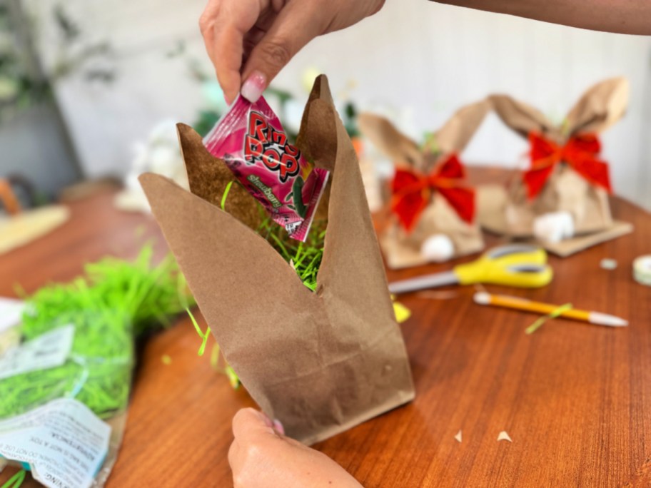 adding faux grass to lunch bag