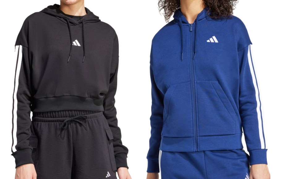 two women in black and blue hoodies