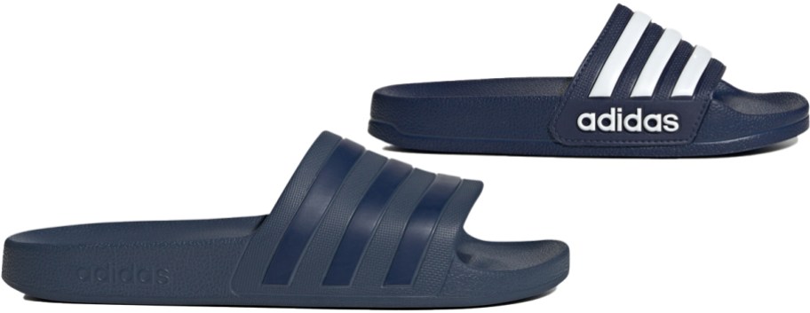 two blue adidas slides