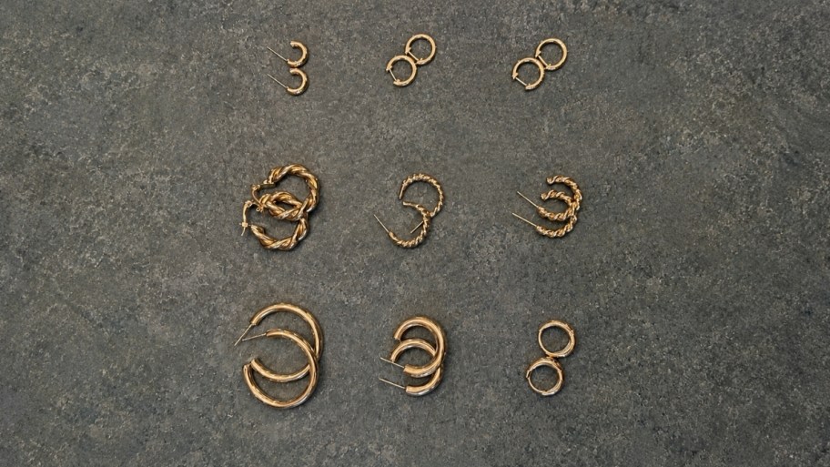 9 pir of gold hoop earrings in arious styles