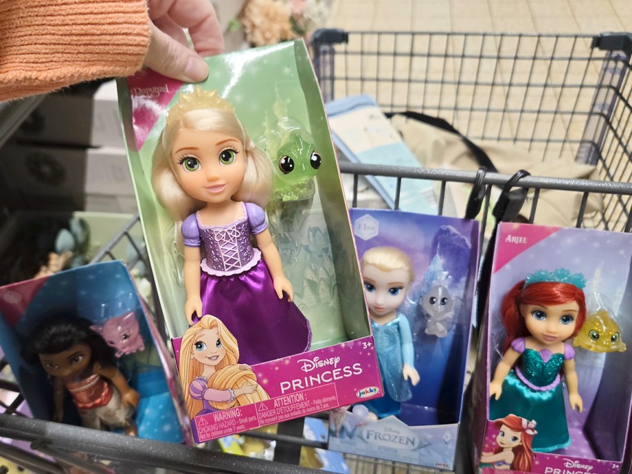 hand holding disney princess doll