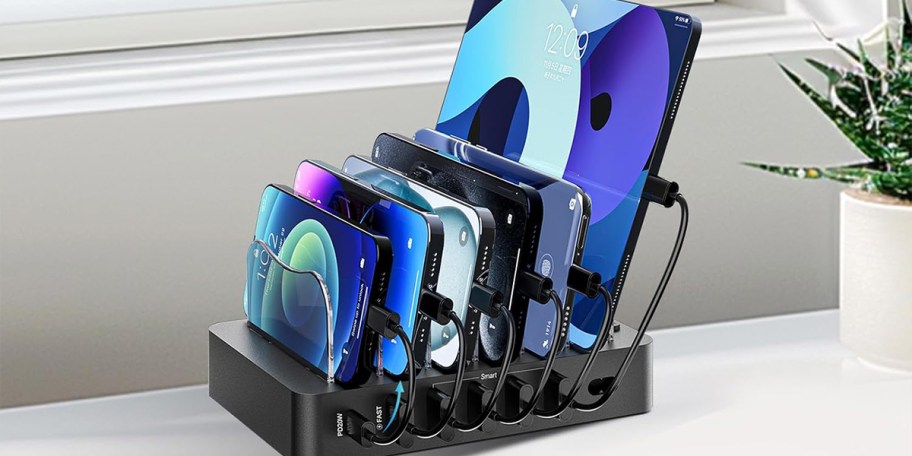 black charging station with phones and tablets charging 