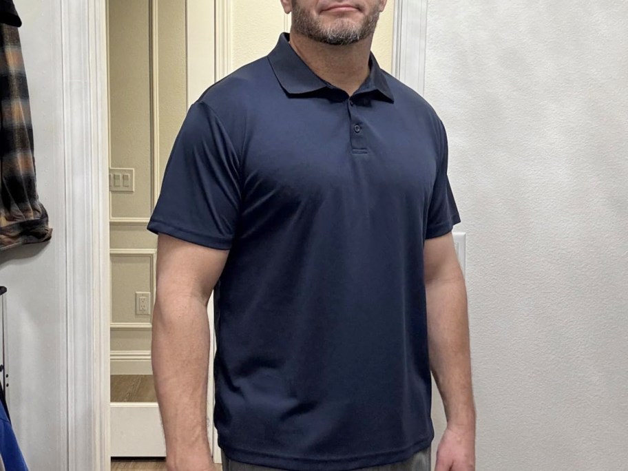 man wearing blue polo shirt 