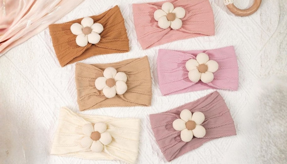 6 baby flower headbands displayed on a tabletop