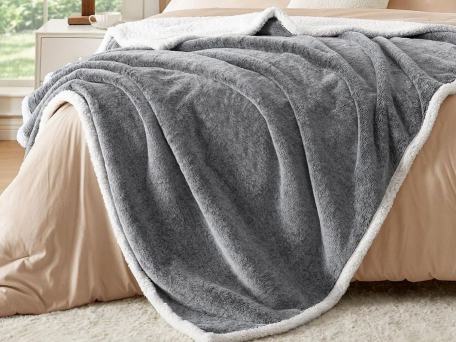 grey twin blanket on bed