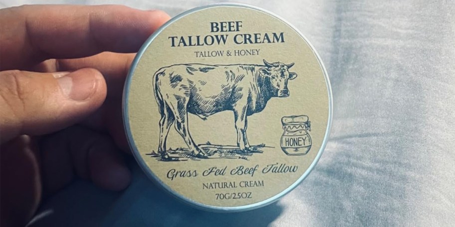 hand holding beef tallow jar 