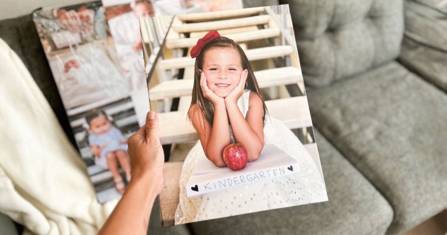 person holding canvas photo from canvas champ