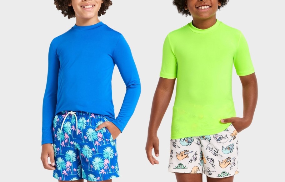 two little boys in rash guards and swim trunks