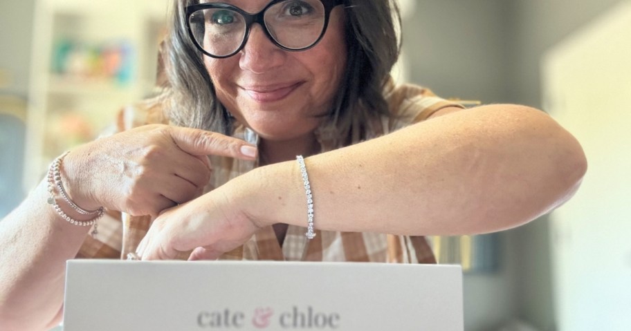 woman showing off a tennis bracelet on her wrist