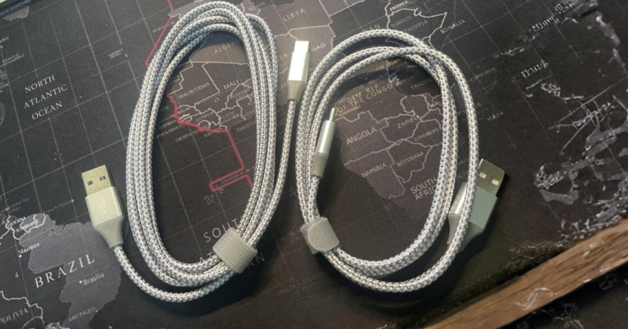 two charging cables on a desk
