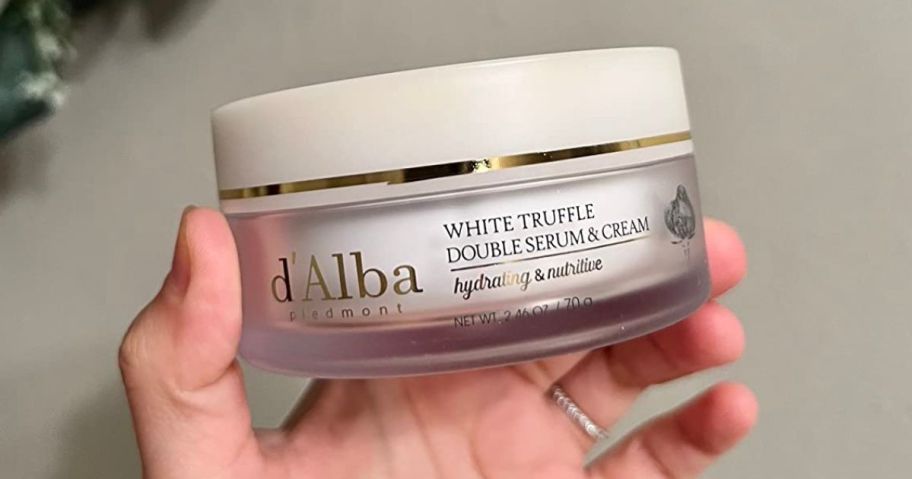 hand holding d'alba Piedmont White Truffle Double Serum & Cream 2.46oz